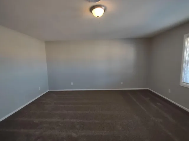 an empty room with a empty space and window