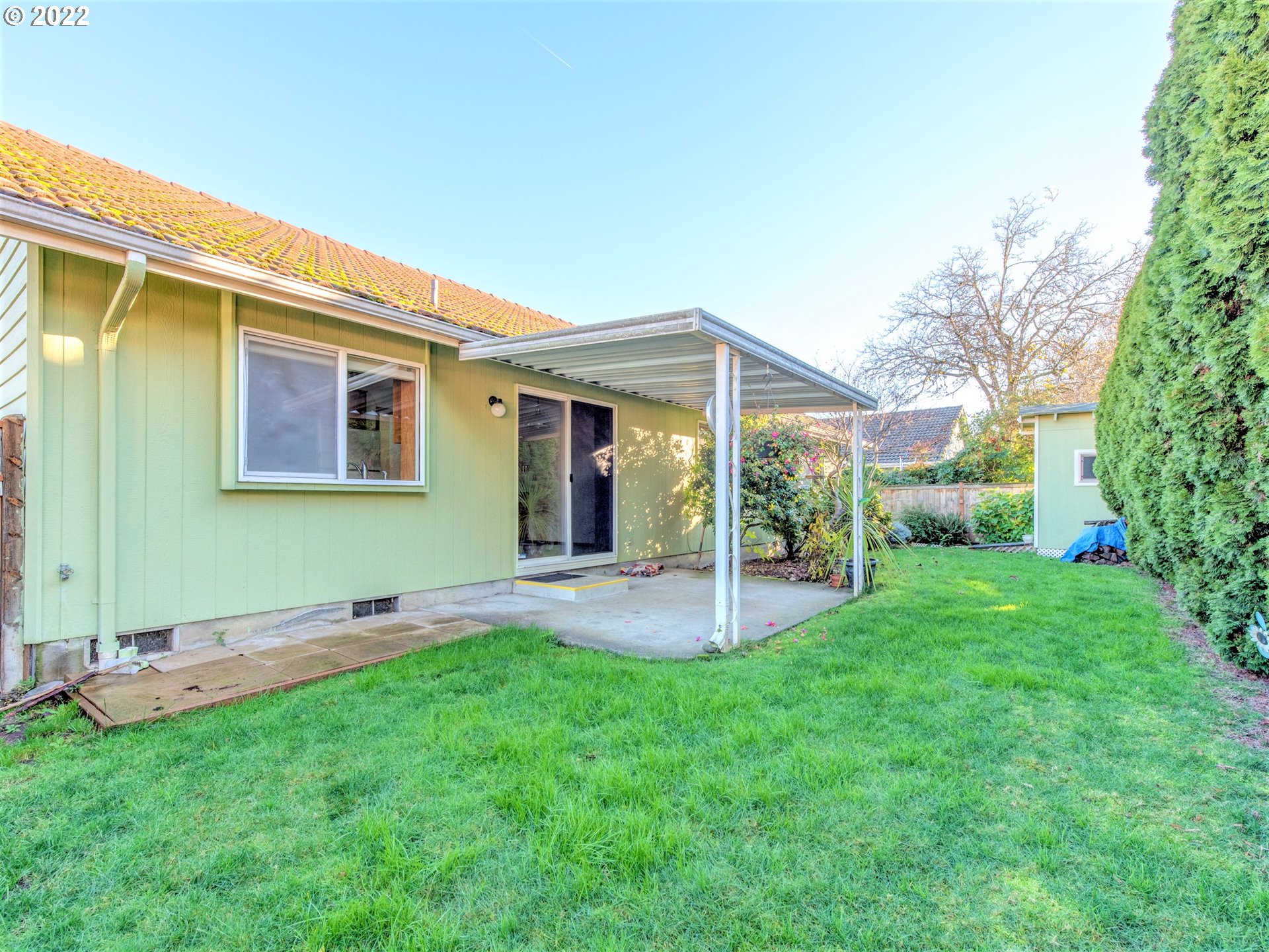 690 Poltava Street Springfield, OR 97477 - Photo 23 of 26 a view of a house with a yard and sitting area