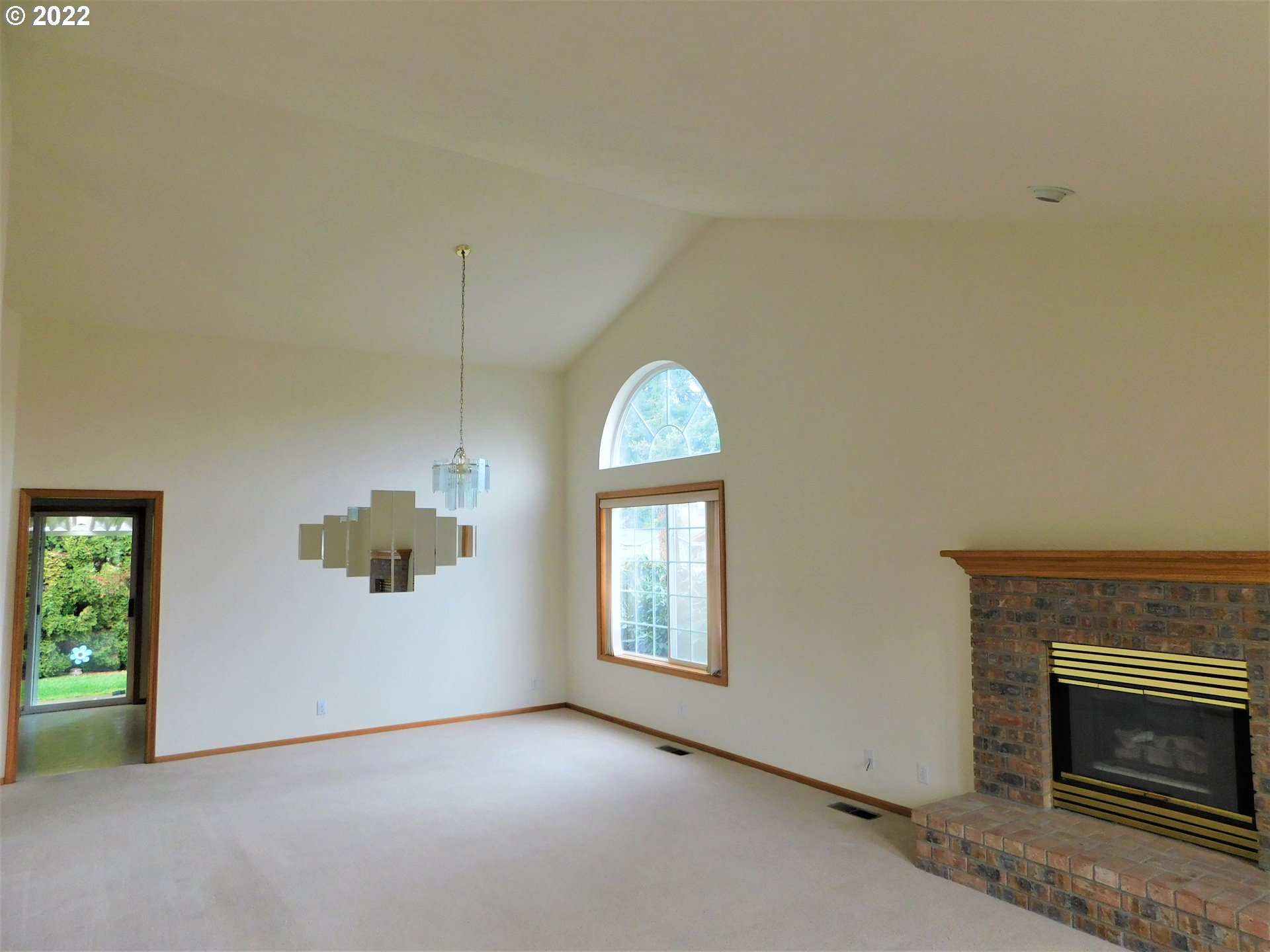 690 Poltava Street Springfield, OR 97477 - Photo 4 of 26 an empty room with windows and fireplace