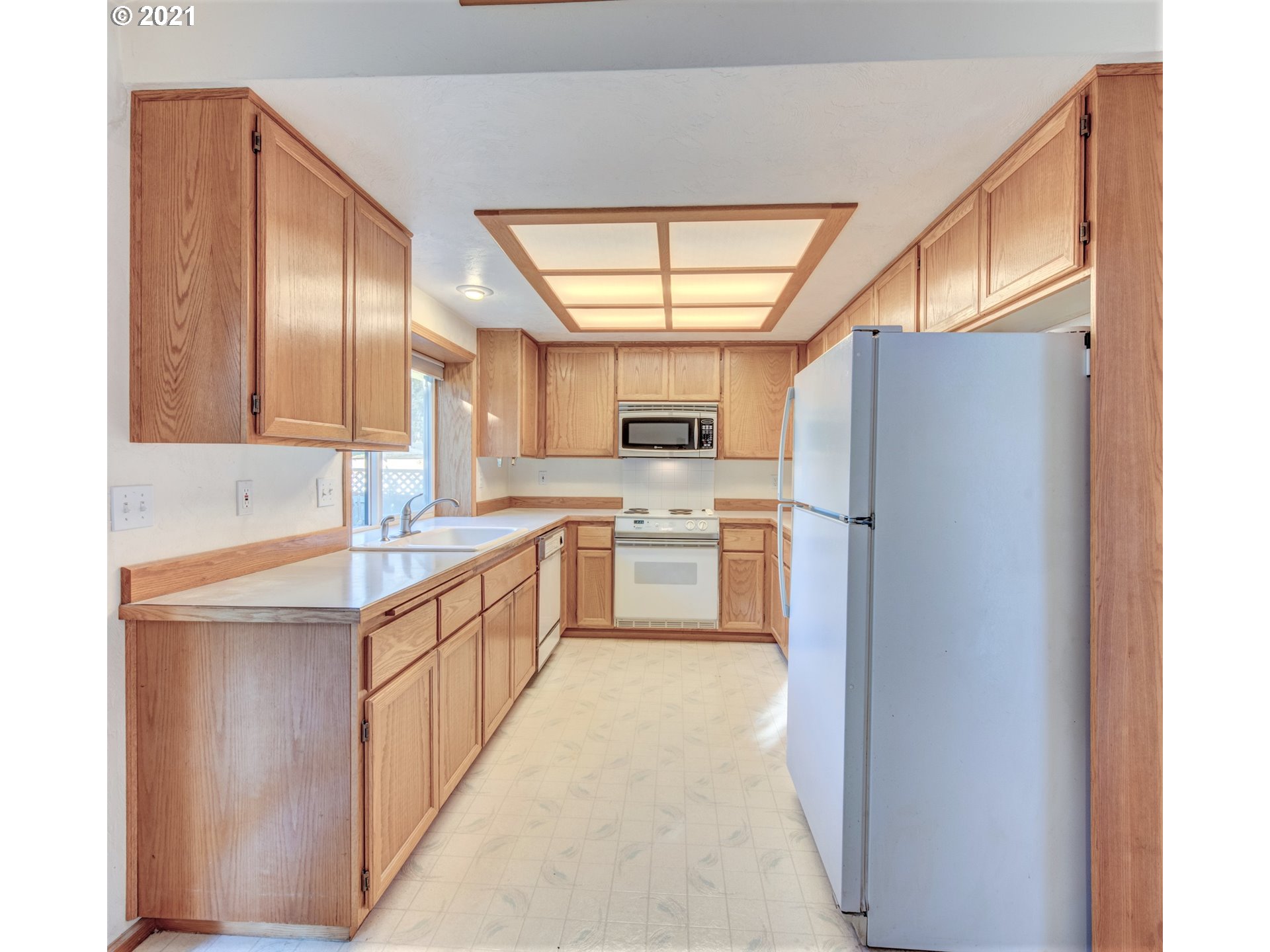 690 Poltava Street Springfield, OR 97477 - Photo 10 of 26 a kitchen with stainless steel appliances a refrigerator and a sink