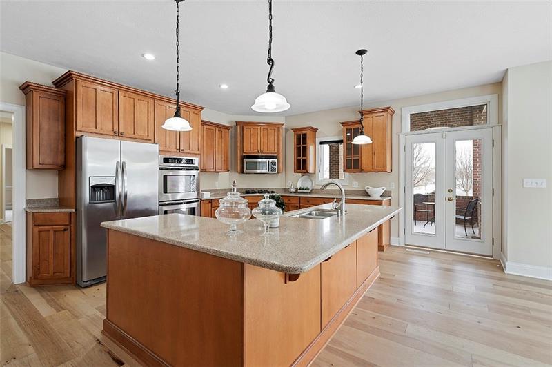 110 Rabold Drive Wexford, PA 15090 - Photo 2 of 25 Beautiful new maple flooring has been installed in the kitchen, foyer, living room, dining room and powder room. The gourmet kitchen is fully equipped with stainless appliances and a double oven.
