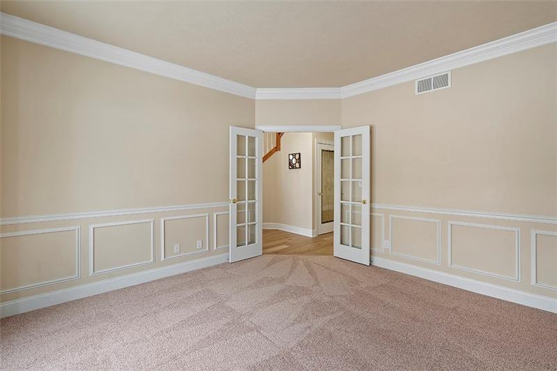 110 Rabold Drive Wexford, PA 15090 - Photo 11 of 25 French doors open to the first floor den with crown molding and new carpeting.