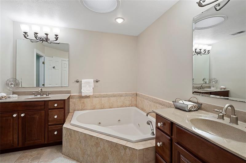 110 Rabold Drive Wexford, PA 15090 - Photo 13 of 25 Relax in the luxurious master bath featuring a custom tile glass shower, two sinks and jetted tub.