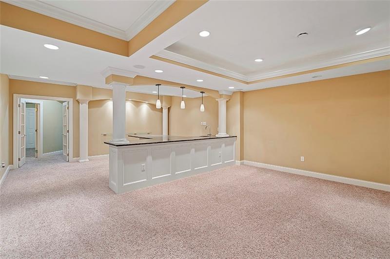 110 Rabold Drive Wexford, PA 15090 - Photo 19 of 25 This level will meet your entertainment needs offering so much space.....a recreational area, wet bar with granite counter tops, possible fifth bedroom and extra storage.