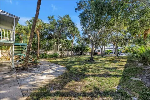 a view of a park with large trees