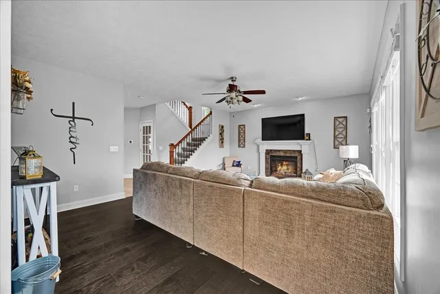 a living room with furniture and a flat screen tv