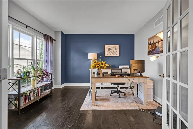 a workspace with furniture and window