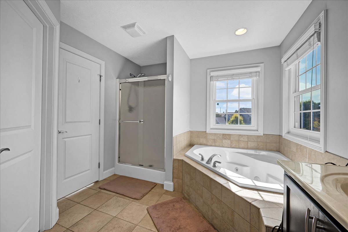 1001 Mugho Court Normal, IL 61761 - Photo 20 of 46 a bathroom with a bathtub and a sink