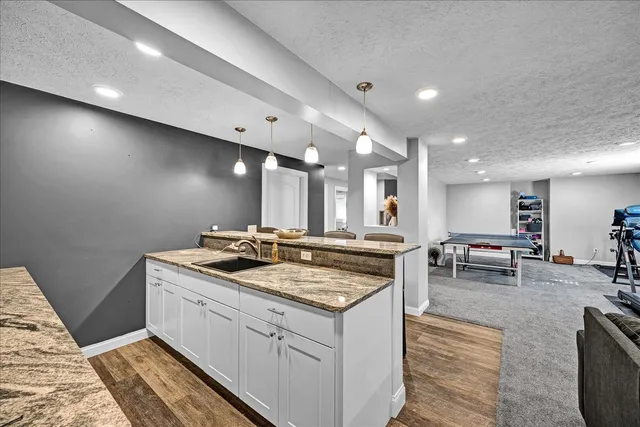 a kitchen with a sink and counter top space