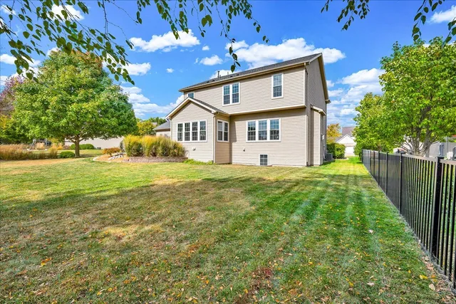 an aerial view of residential houses with outdoor space and swimming pool