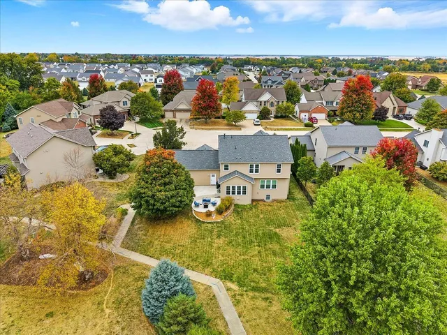 an aerial view of residential houses with outdoor space