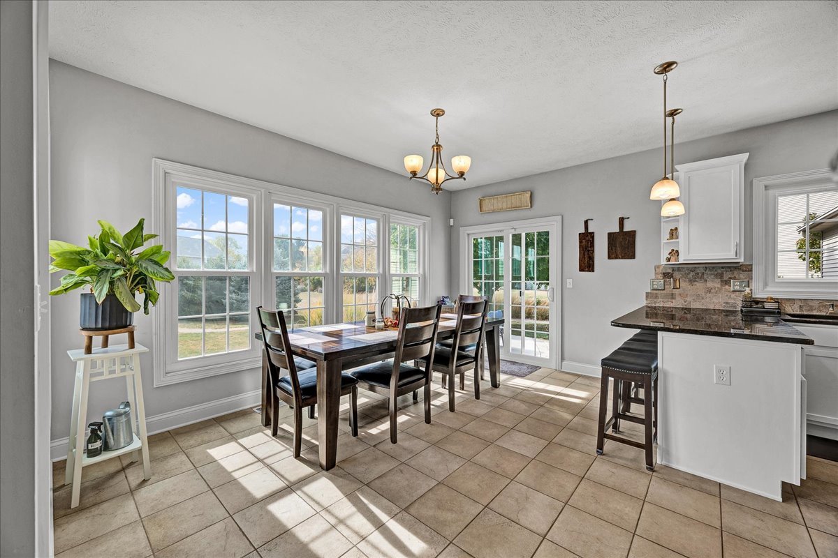 1001 Mugho Court Normal, IL 61761 - Photo 4 of 46 a view of a dining room with furniture window and outside view