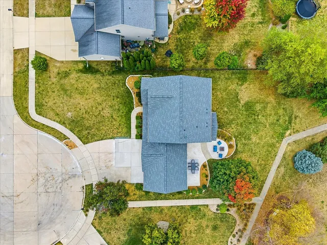 an aerial view of residential houses with outdoor space
