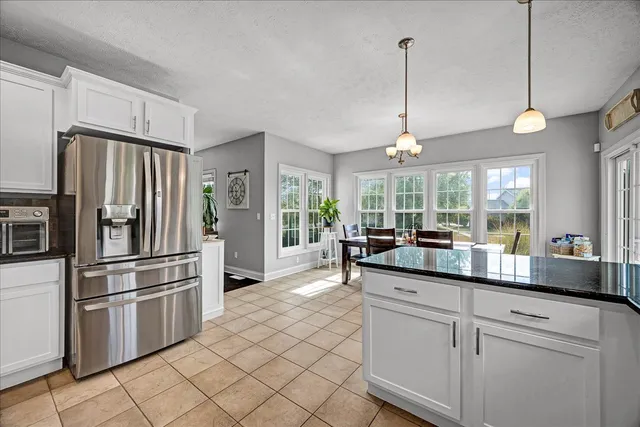 a kitchen with counter top space and stainless steel appliances