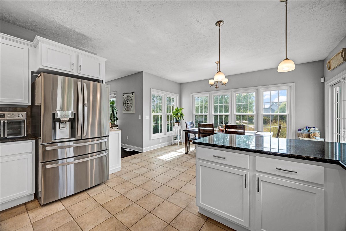 1001 Mugho Court Normal, IL 61761 - Photo 6 of 46 a kitchen with counter top space and stainless steel appliances