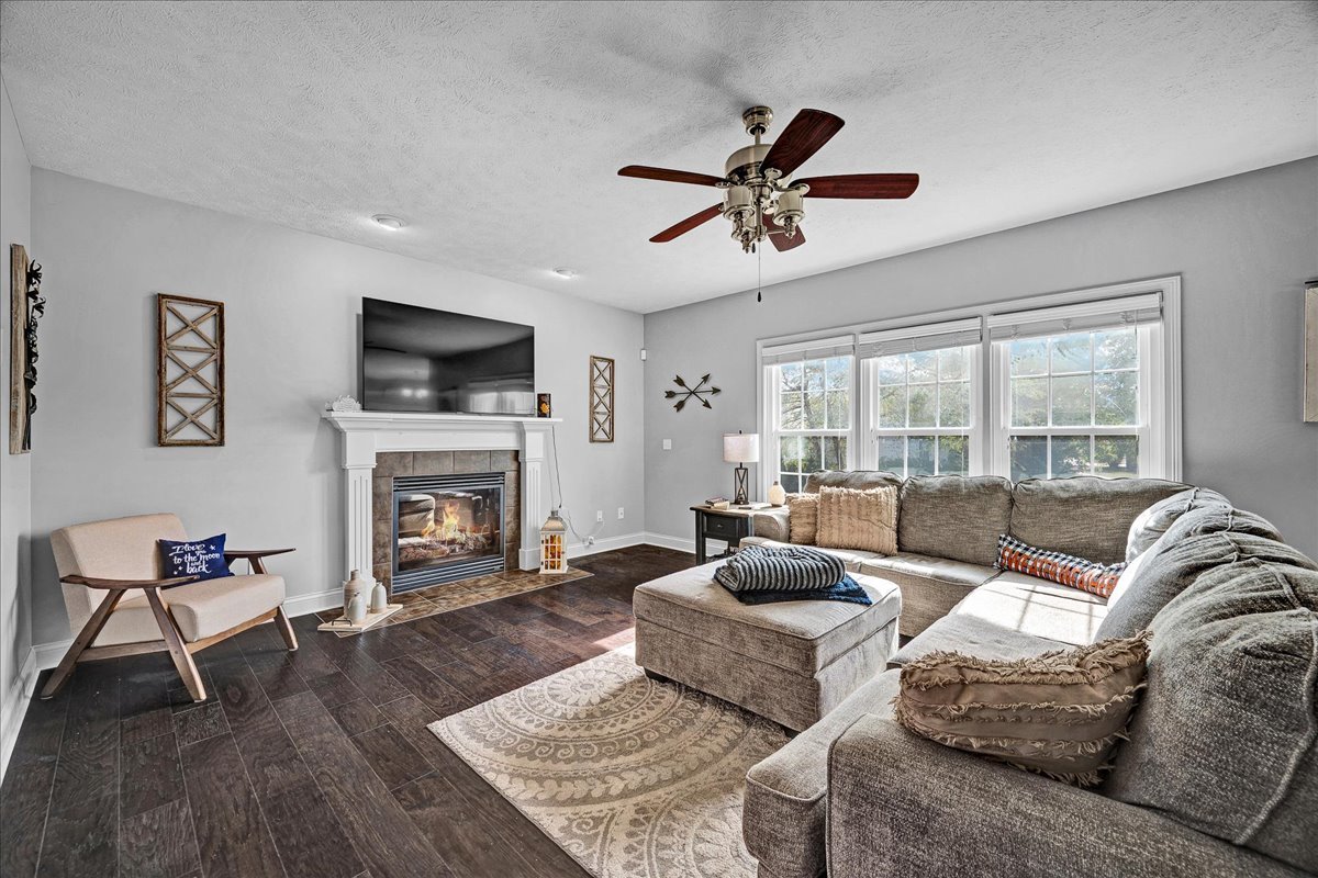 1001 Mugho Court Normal, IL 61761 - Photo 9 of 46 a living room with furniture fireplace and a flat screen tv