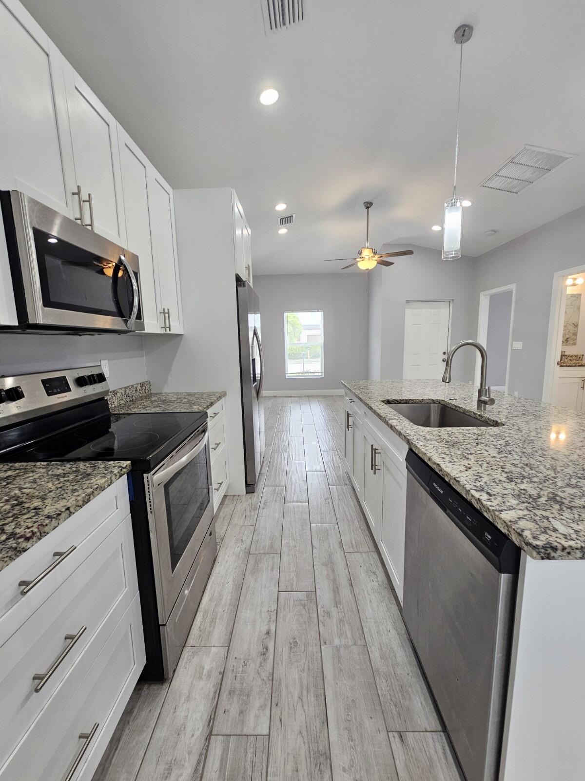 1558 West 26th Court Riviera Beach, FL 33404 - Photo 11 of 34 20250827_111629_copy_1200x1600