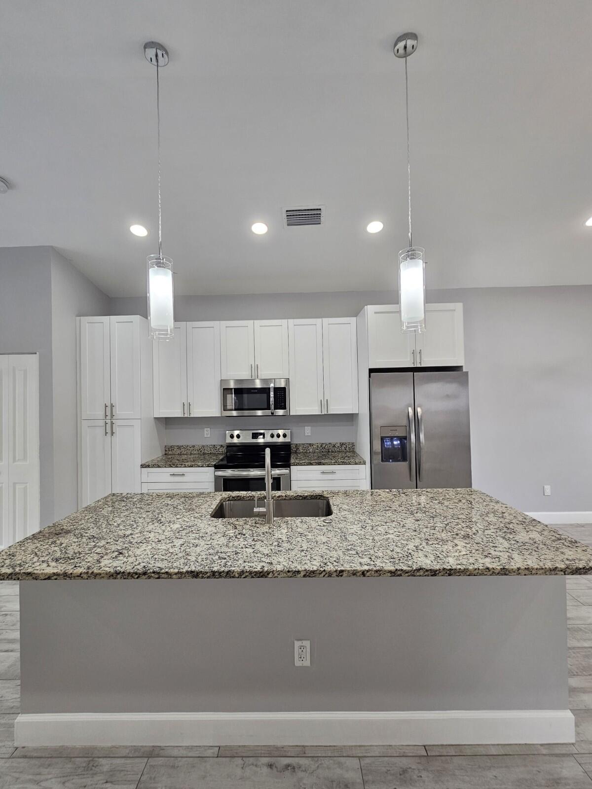 1558 West 26th Court Riviera Beach, FL 33404 - Photo 7 of 34 20250827_111543_copy_1200x1600