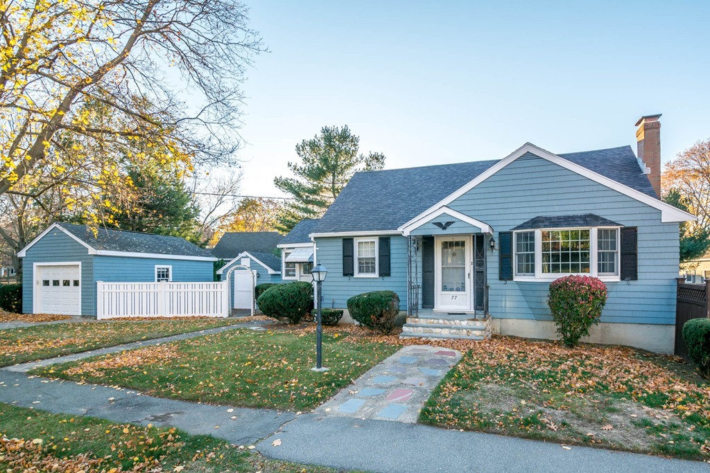 77 Sturges Road Reading, MA 01867 - Photo 1 of 19 front view of a house and a yard