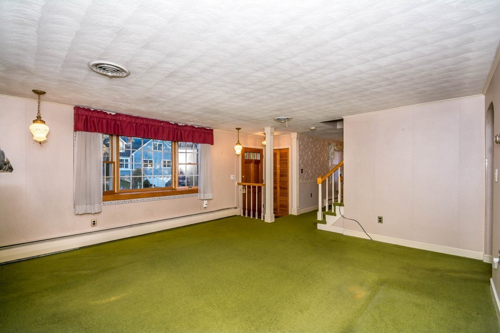 77 Sturges Road Reading, MA 01867 - Photo 3 of 19 a view of an empty room with a window