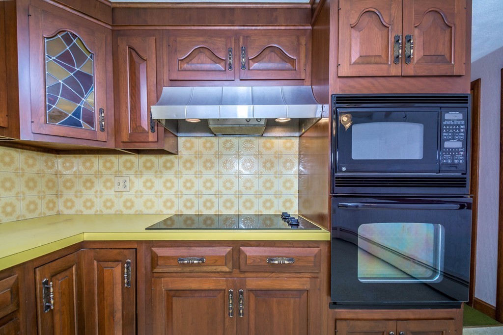77 Sturges Road Reading, MA 01867 - Photo 8 of 19 a view of cabinets and wooden floor