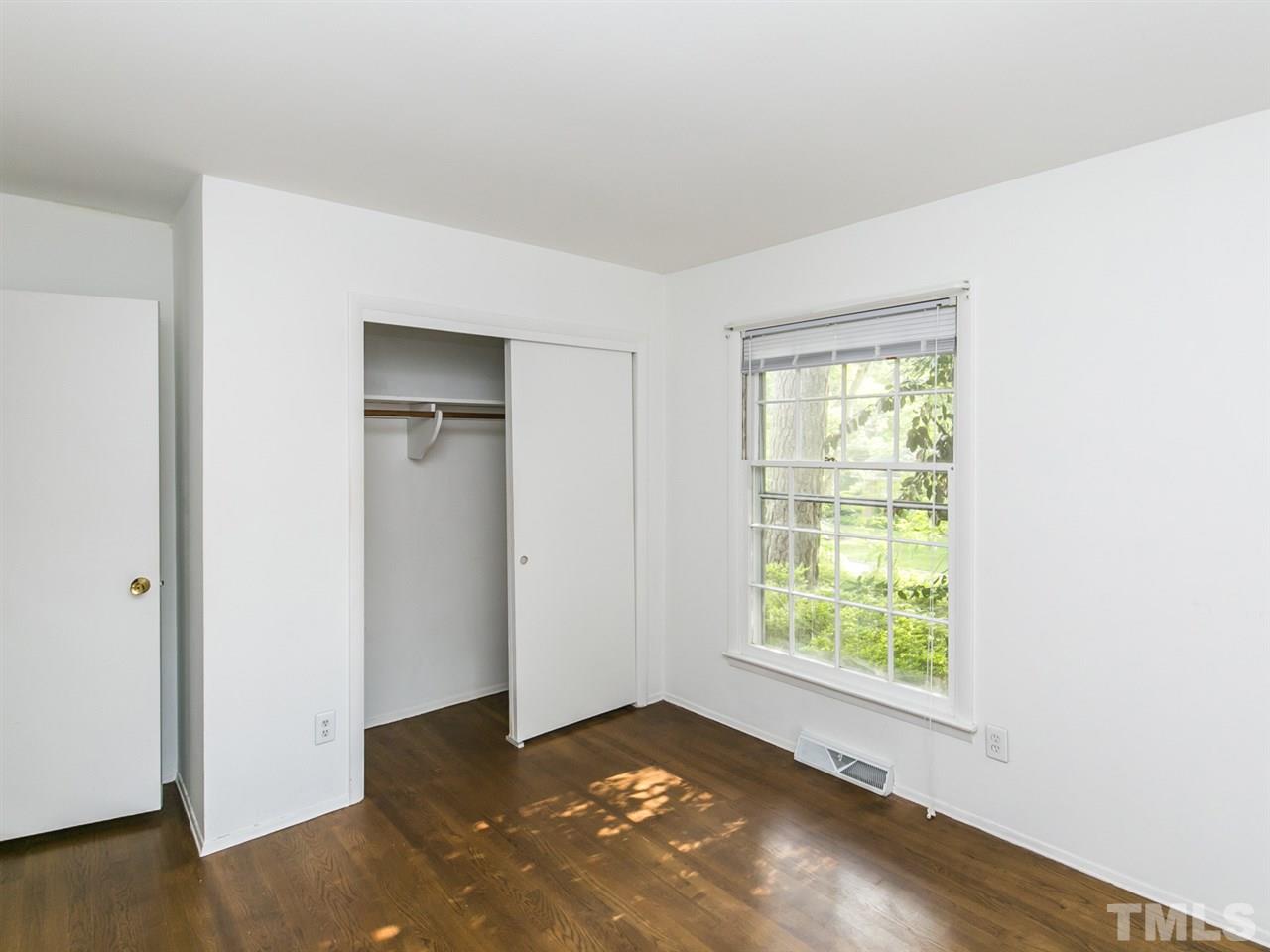 4813 Radcliff Road Raleigh, NC 27609 - Photo 14 of 22 an empty room with windows
