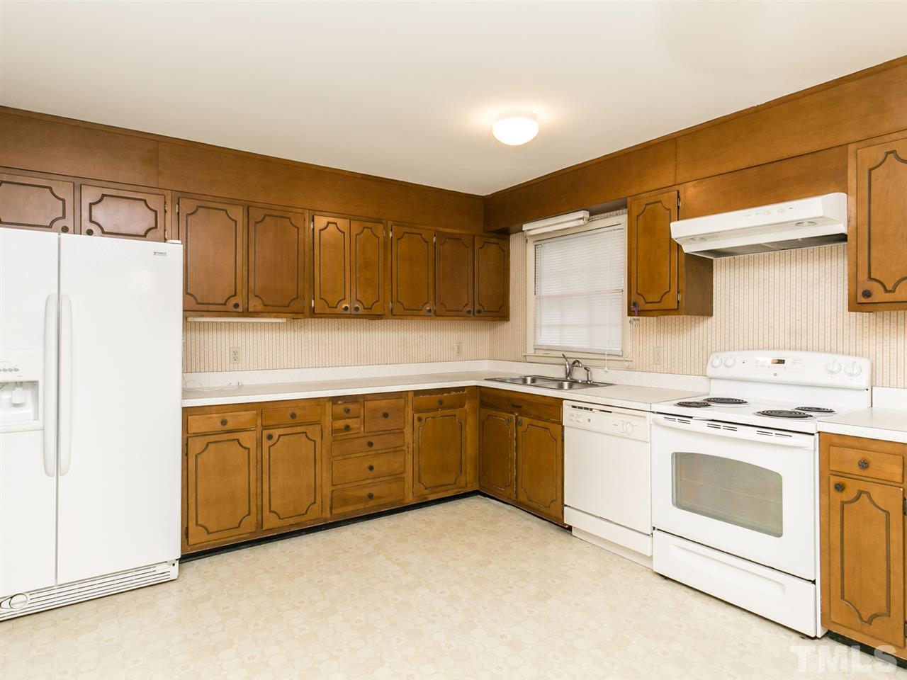 4813 Radcliff Road Raleigh, NC 27609 - Photo 3 of 22 a kitchen with granite countertop cabinets stainless steel appliances and a sink