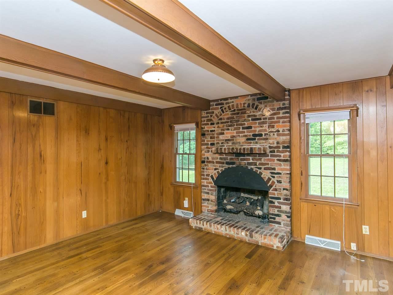 4813 Radcliff Road Raleigh, NC 27609 - Photo 7 of 22 a living room with furniture and a fireplace