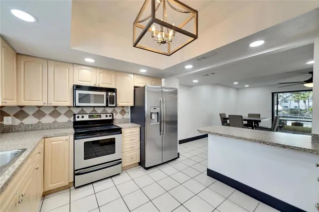 a view of a hallway with wooden floor and entryway