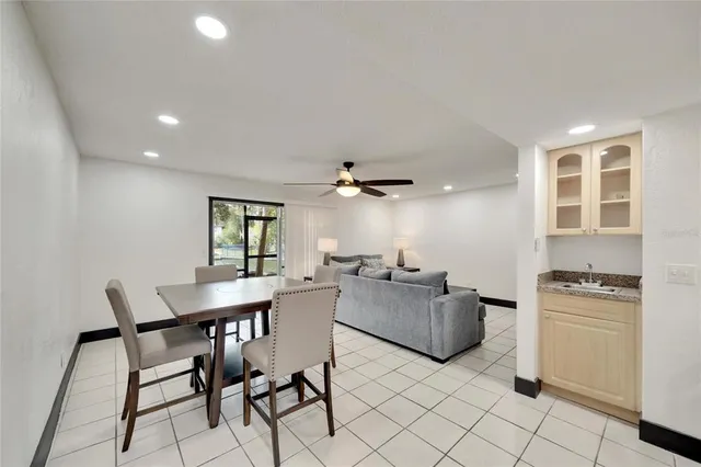 a kitchen with a sink and white cabinets