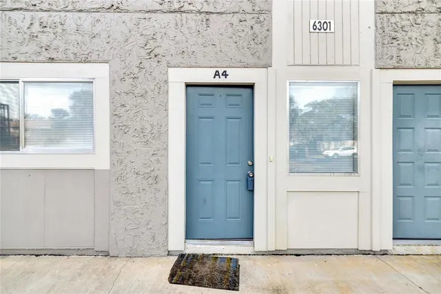 a kitchen with stainless steel appliances granite countertop a refrigerator and a stove