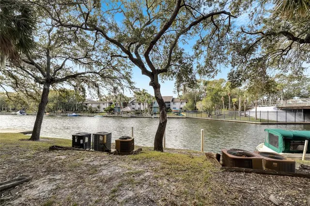 a view of a hallway to closet and wooden floor