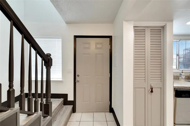 a kitchen with a sink cabinets and window