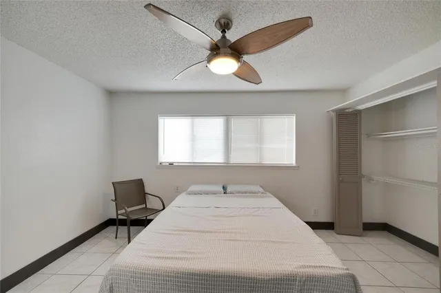 a view of a big room with wooden floor and windows