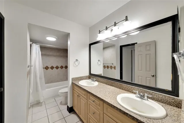 an aerial view of a house with garden space and outdoor seating