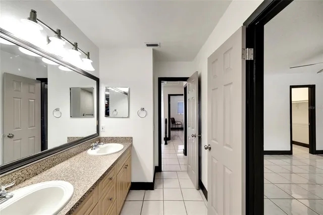 an aerial view of a house with garden space and lake view