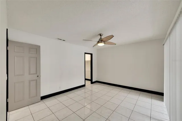 an aerial view of residential houses with outdoor space and ocean view