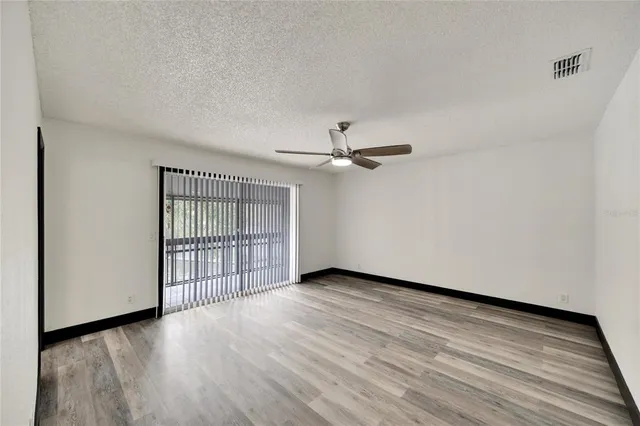 an aerial view of residential houses with outdoor space and river