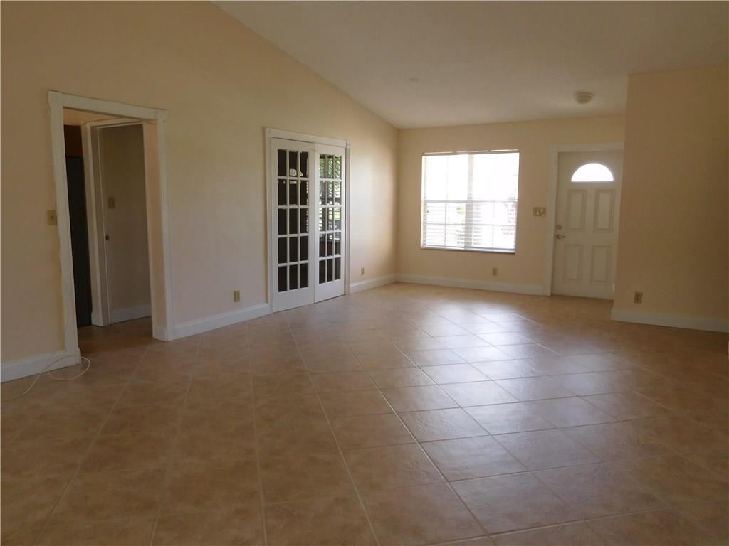 18897 Cloud Lake Circle Boca Raton, FL 33496 - Photo 11 of 23 an empty room with windows and entrance