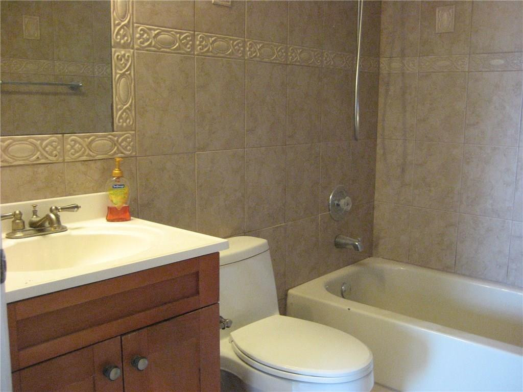 18897 Cloud Lake Circle Boca Raton, FL 33496 - Photo 14 of 23 a bathroom with a sink a toilet and shower