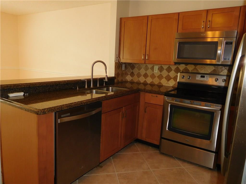 18897 Cloud Lake Circle Boca Raton, FL 33496 - Photo 5 of 23 a kitchen with a sink and cabinets
