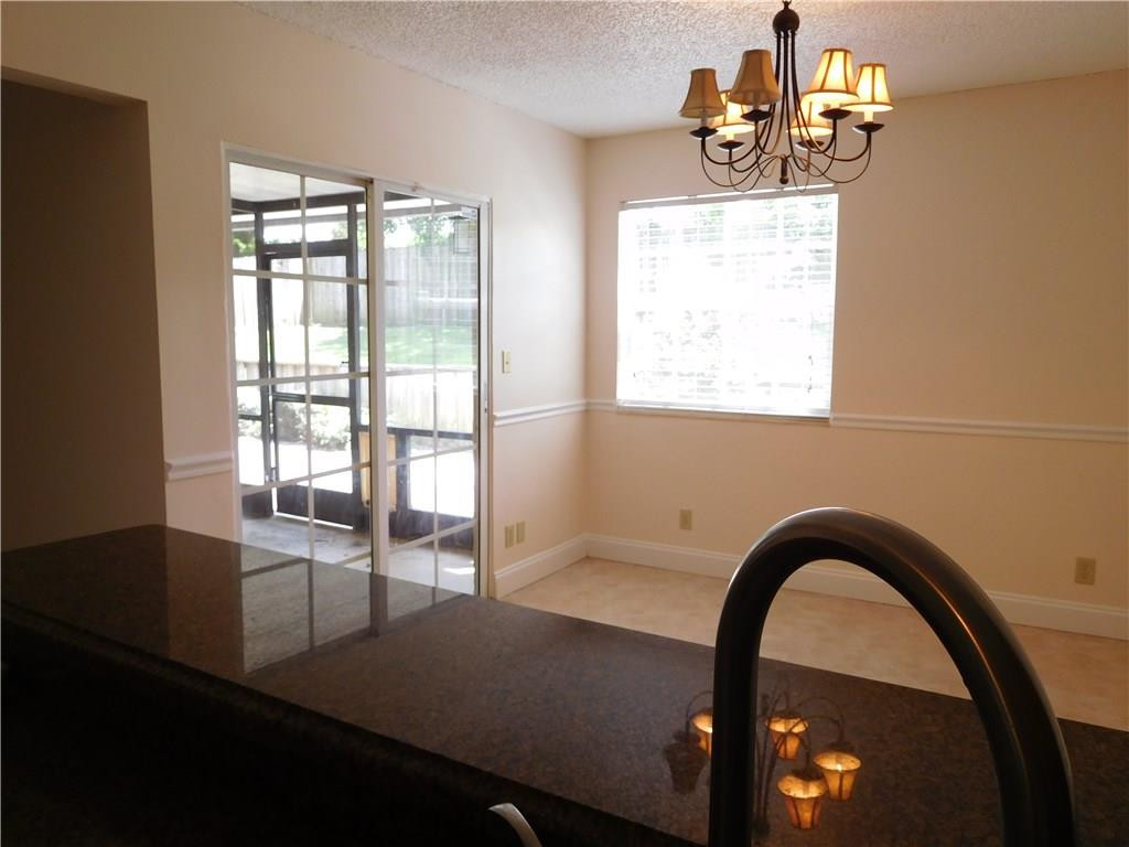 18897 Cloud Lake Circle Boca Raton, FL 33496 - Photo 7 of 23 a view of a room with a dining table and chairs