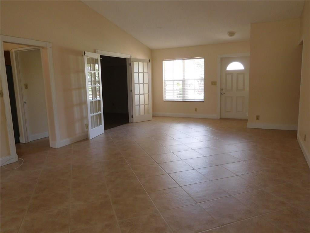 18897 Cloud Lake Circle Boca Raton, FL 33496 - Photo 10 of 23 a view of a big room with windows and chandelier fan