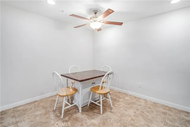 an empty room with wooden floor and sliding door