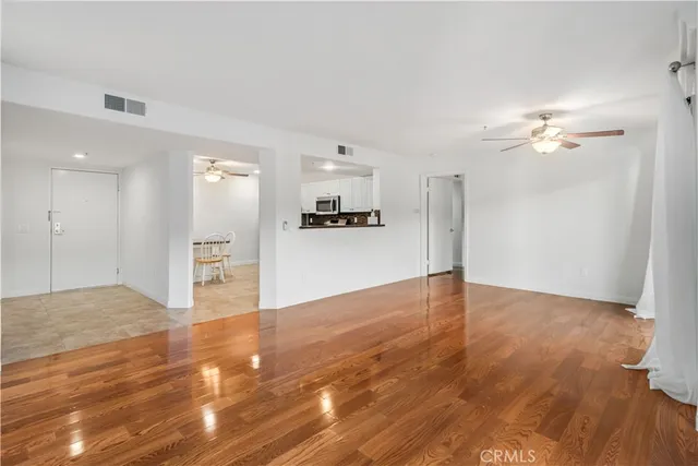 a view of a kitchen with a sink and a stove