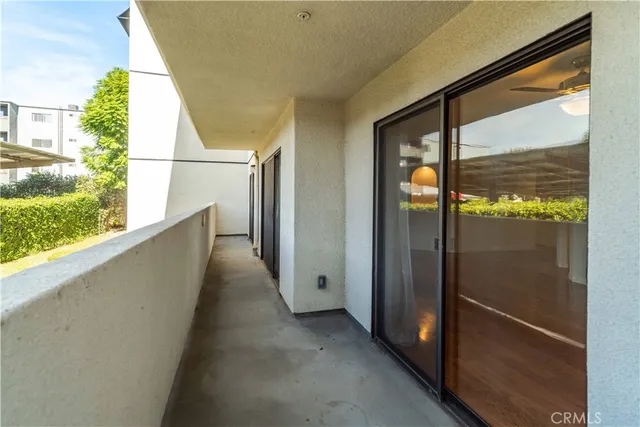 a view of a glass door with a balcony