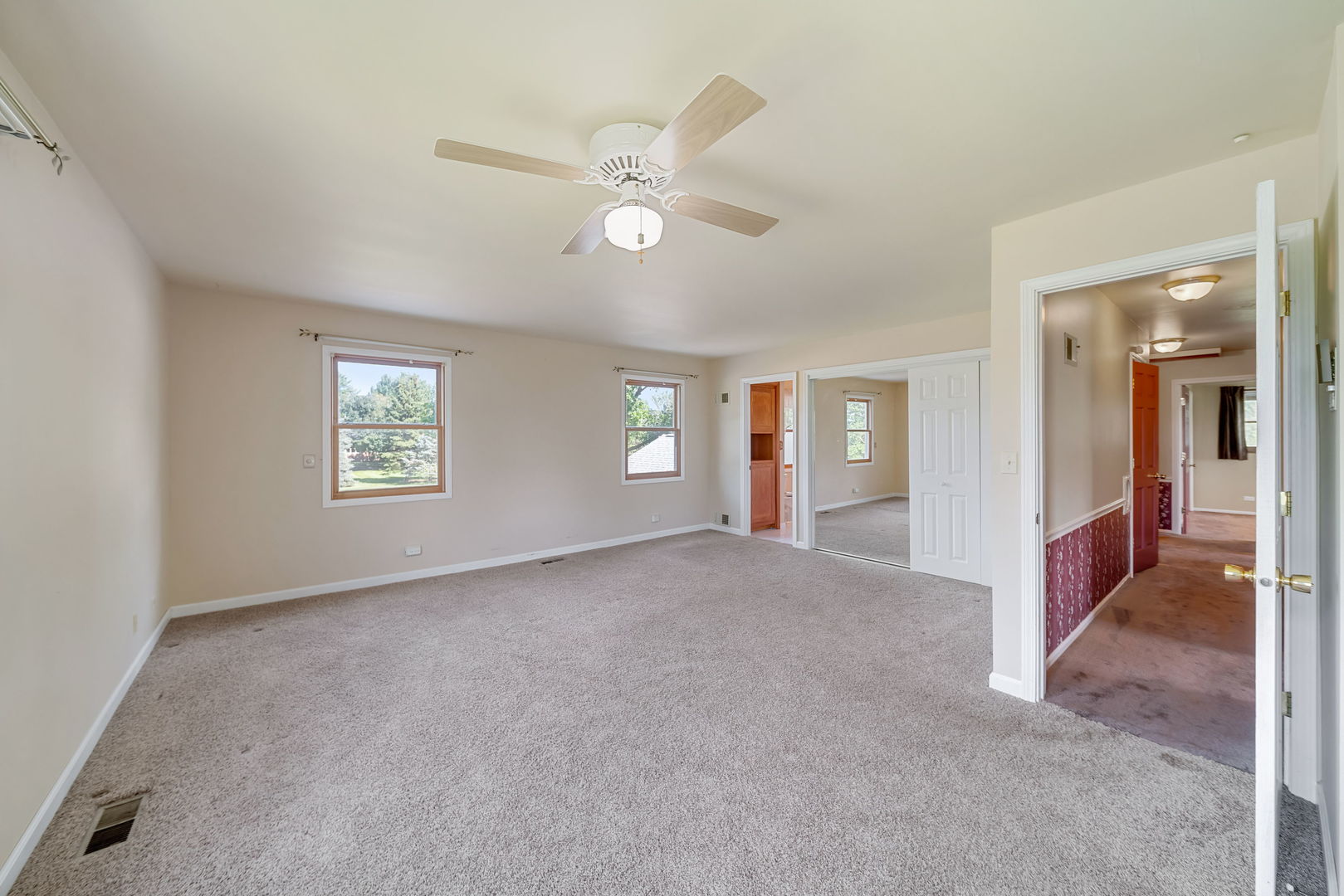 8515 Schmidt Street Spring Grove, IL 60081 - Photo 35 of 43 an empty room with windows and fan