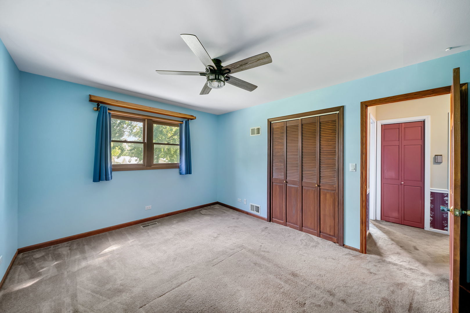 8515 Schmidt Street Spring Grove, IL 60081 - Photo 38 of 43 an empty room with windows and fan