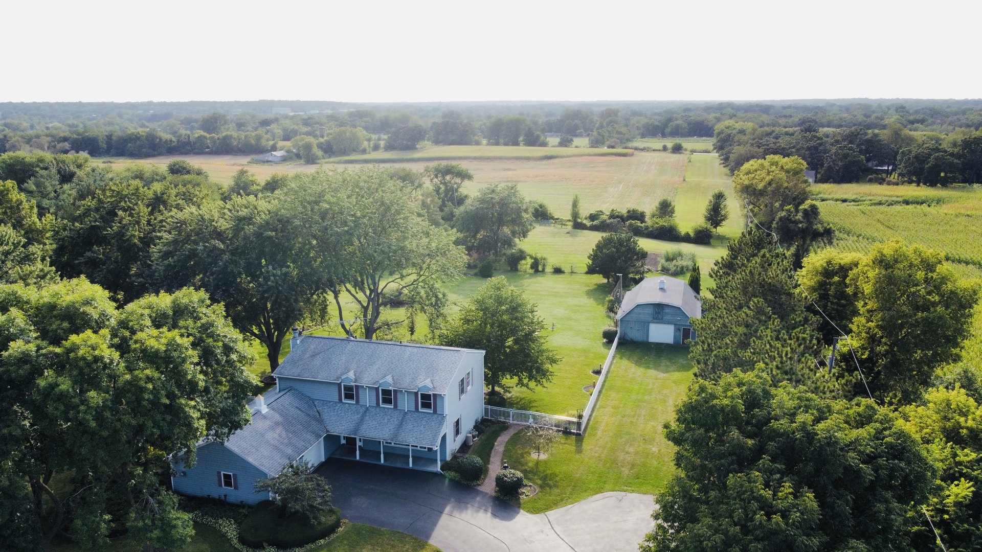 8515 Schmidt Street Spring Grove, IL 60081 - Photo 5 of 43 an aerial view of a house with a lake view