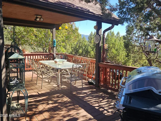 a view of a chairs and table in the patio